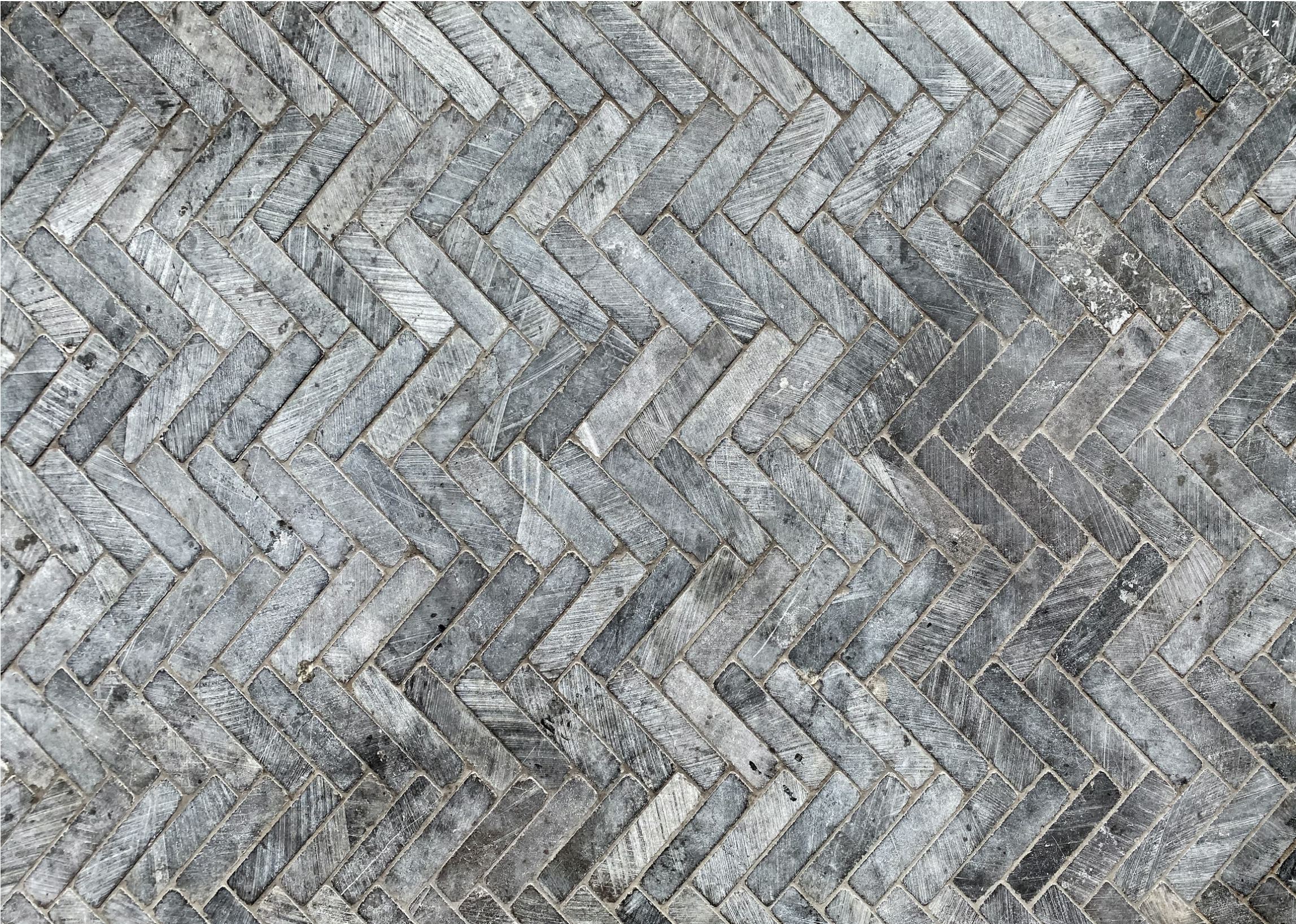 Gray herringbone walkway tile pattern