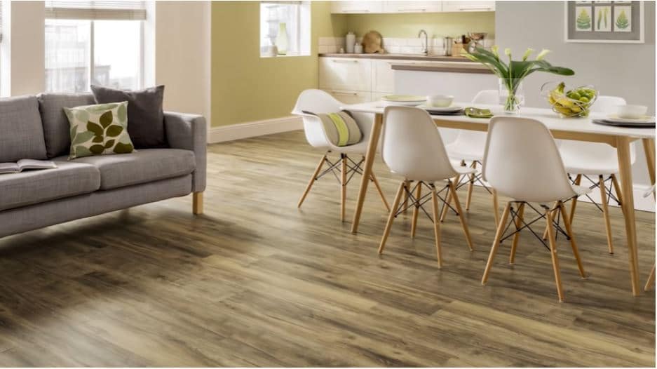 A kitchen with loose lay flooring featuring a natural stone look